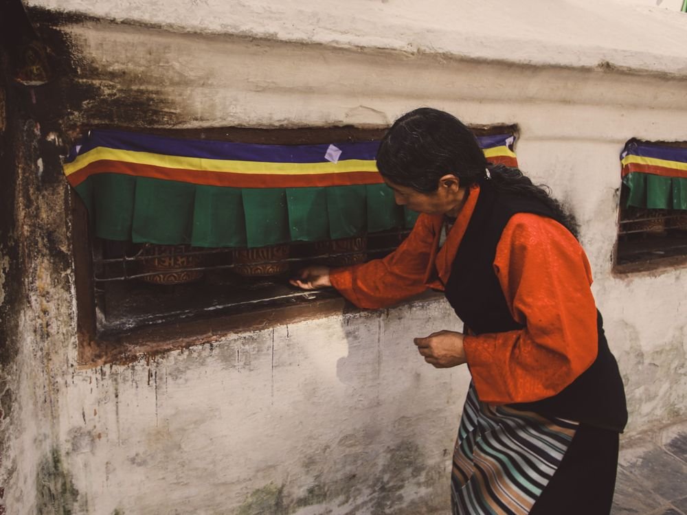 Turning prayer wheels in Bhutan