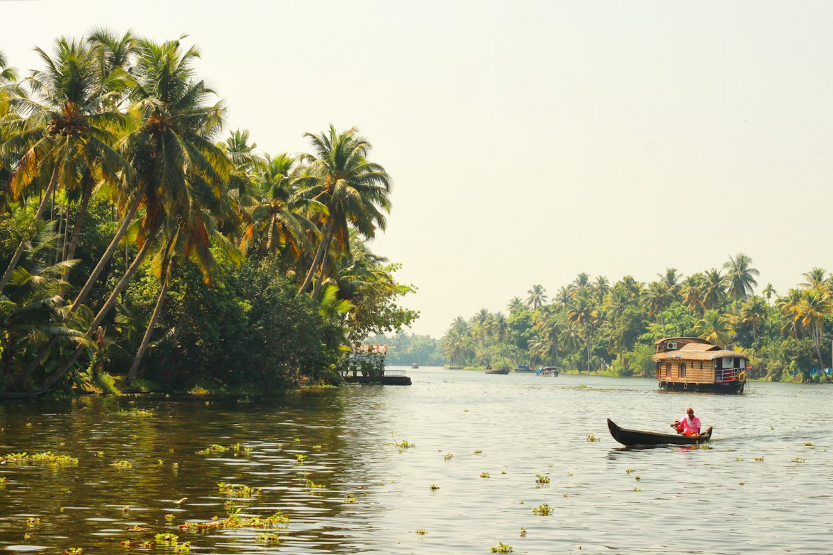 A houseboat and a country boat on the backwaters of Kerala