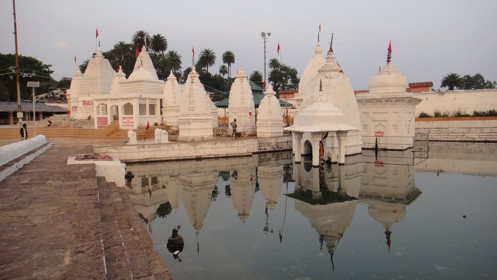 White temples reflected in a temple pond