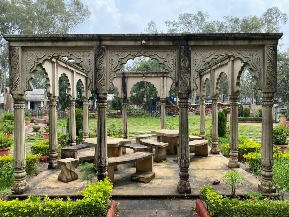A stone pavilion in a Pachmarhi garden