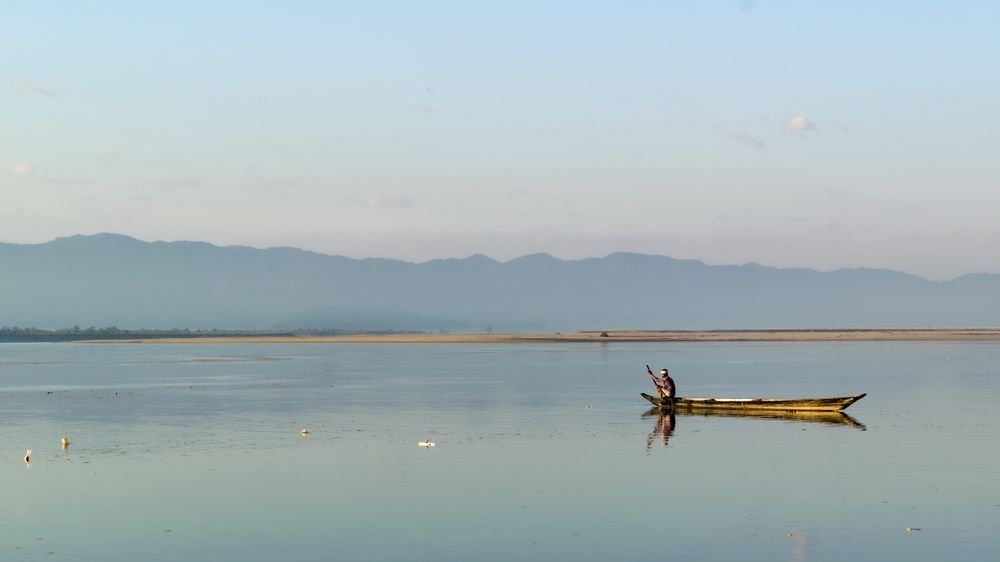 A fisherman on the calm Brahmaputra, Assam