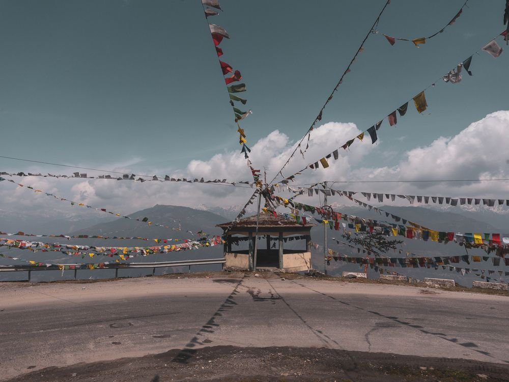 Prayer flags on a mountain road in Tawang