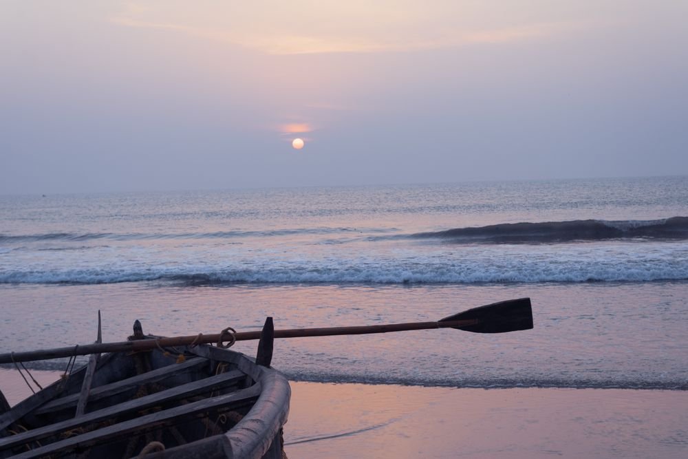 Fishing boats on the beach at dusk