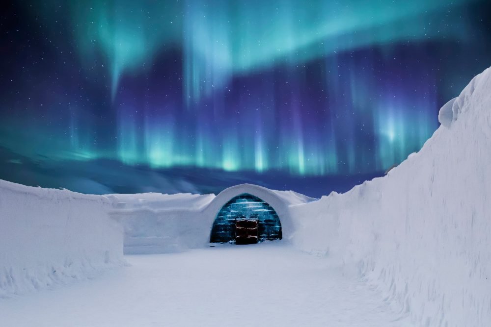 An igloo under the northern lights