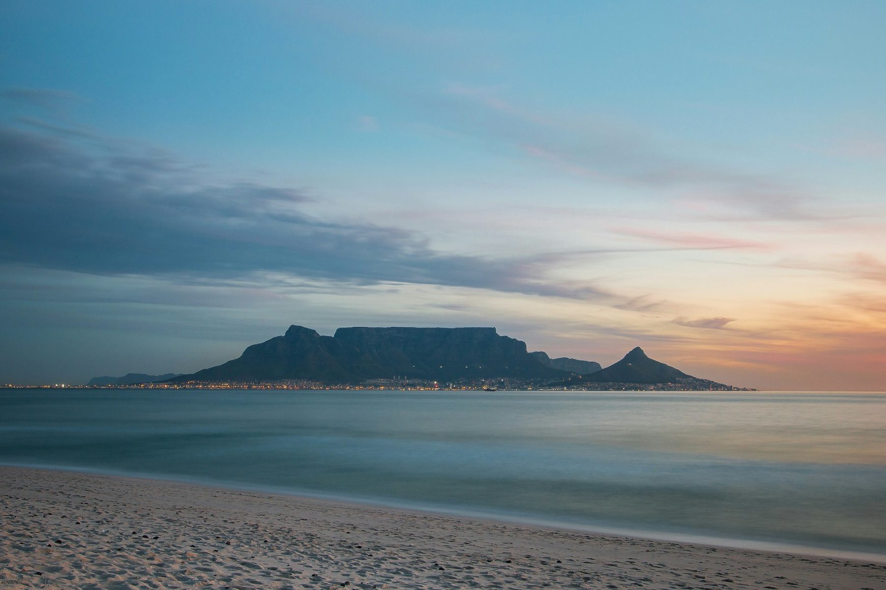 Table Mountain across Table Bay from Bloubergstrand at sunset